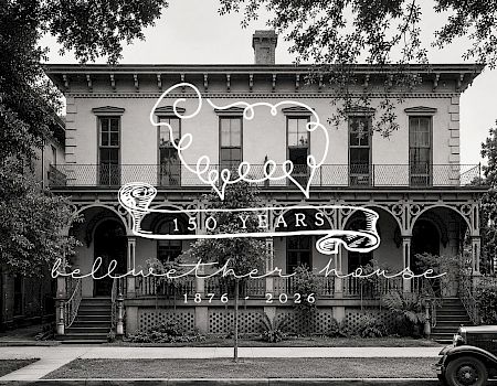 A black-and-white photo of a two-story house with a wraparound porch, trees framing the front, and a vintage car parked out front, with decorative text overlaid.