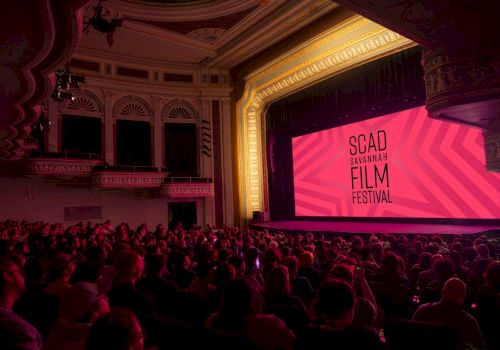 A packed theater watches the SCAD Savannah Film Festival screen during a film showing.